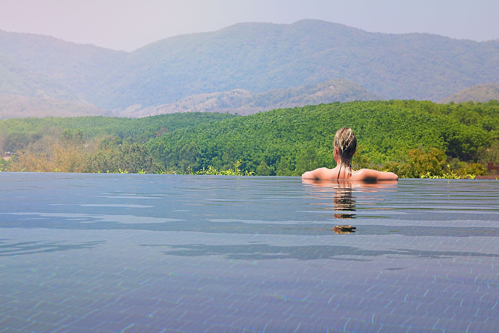 Relaxing spa pool surrounded by tropical greenery